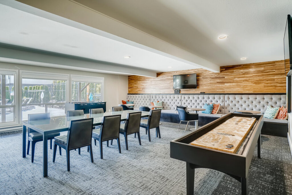 Clubhouse lounge with tables and games