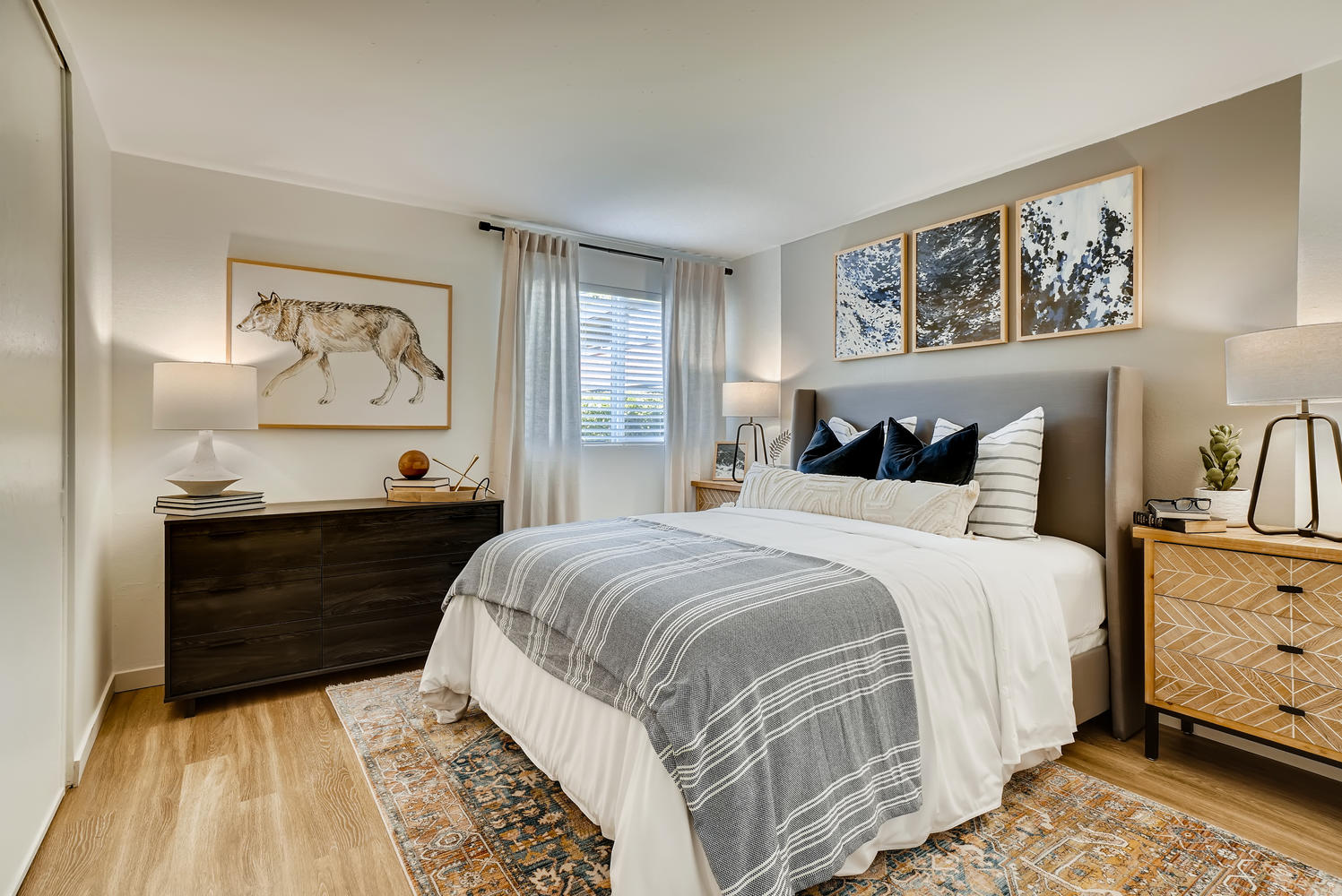 Furnished bedroom with gray accent wall at Park 120 apartments for rent in Everett, WA