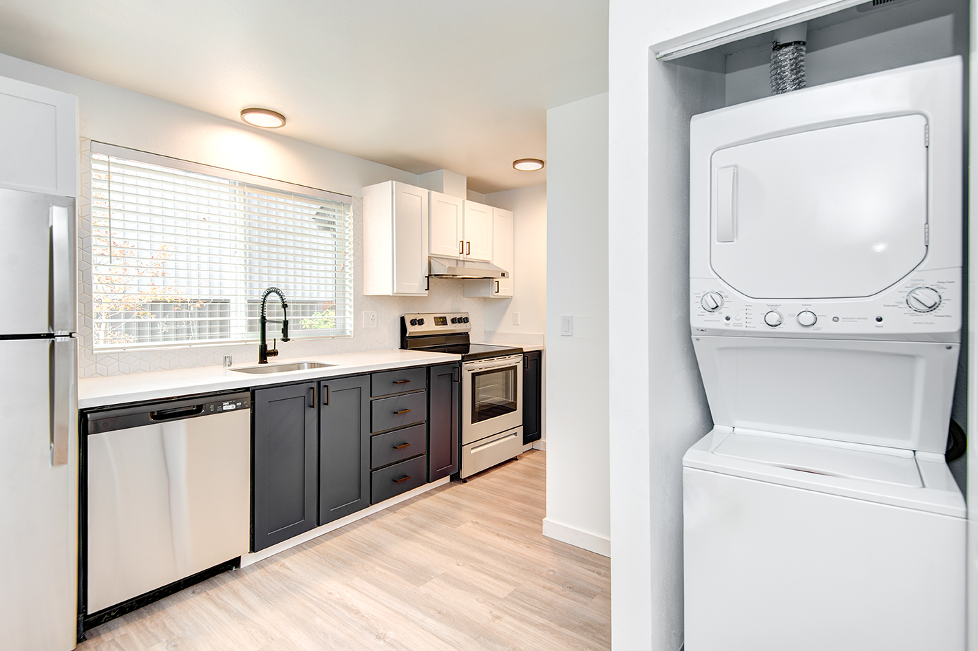 washer and dryer in a closet by the kitchen