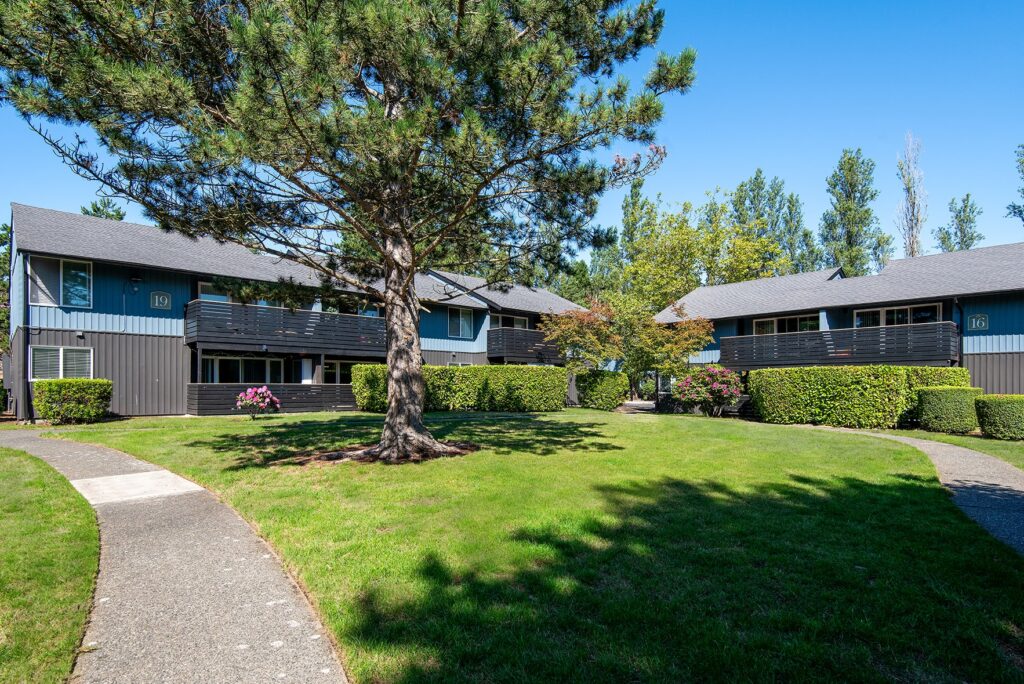 Garden style property with well maintained grass.