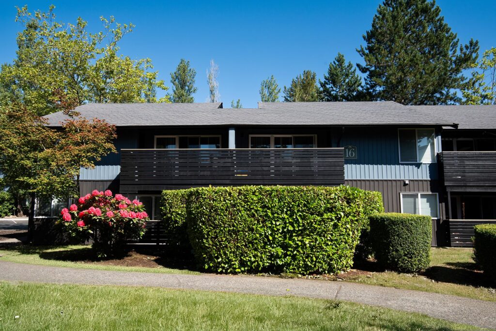 Garden style property with well maintained grass.